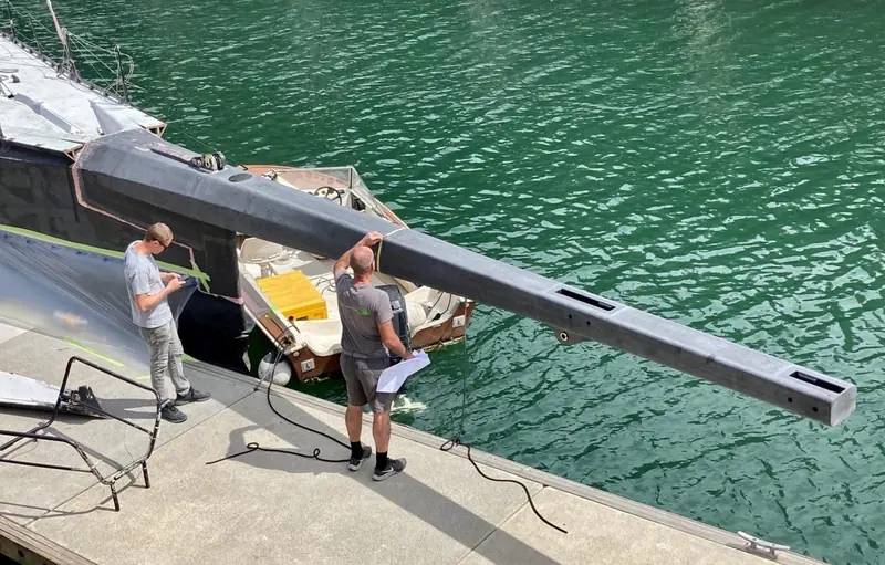Fitting LawConnect's carbon bowsprit on the dock